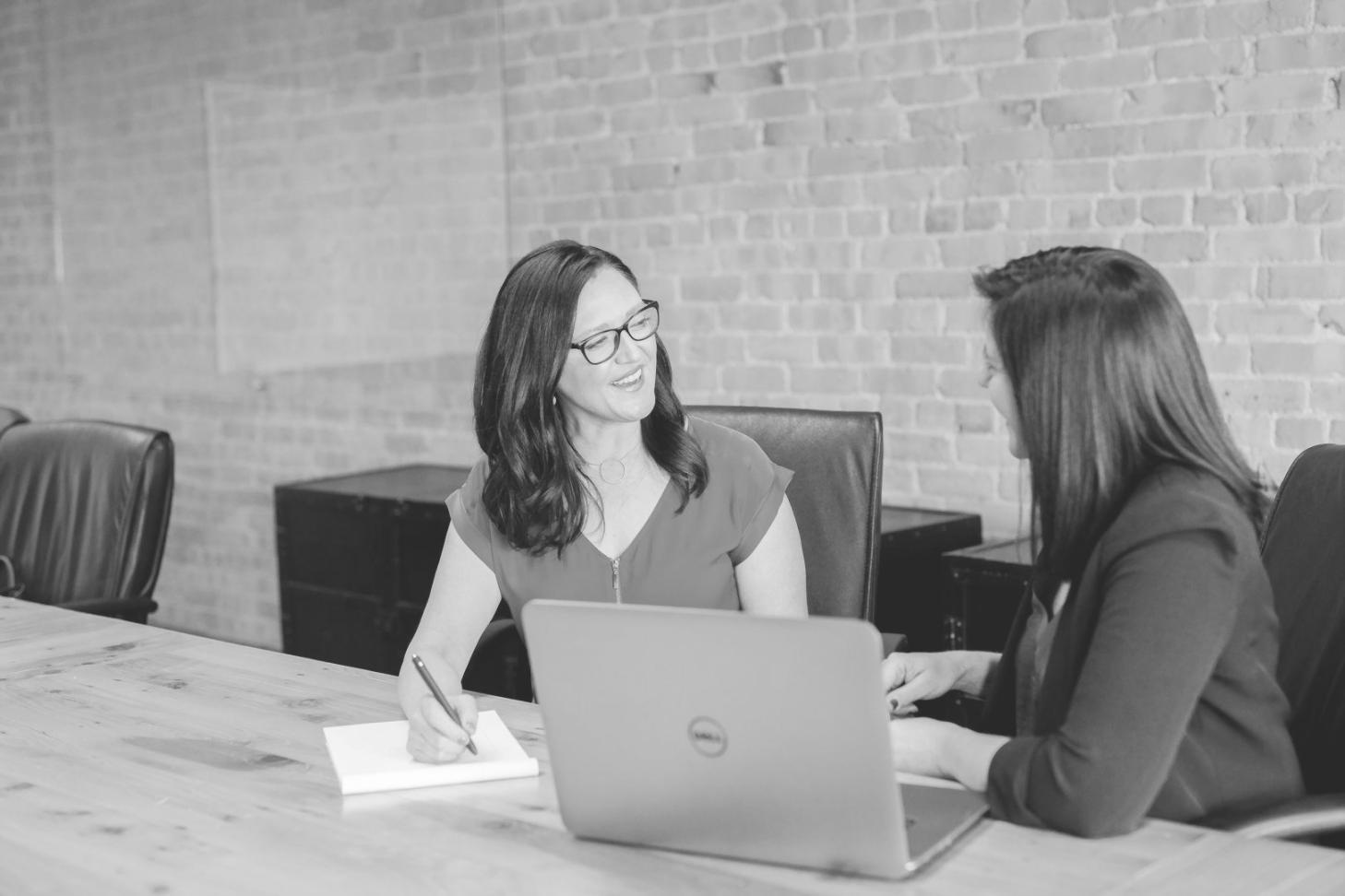 Detailed financial analysis and recovery planning documents spread on desk